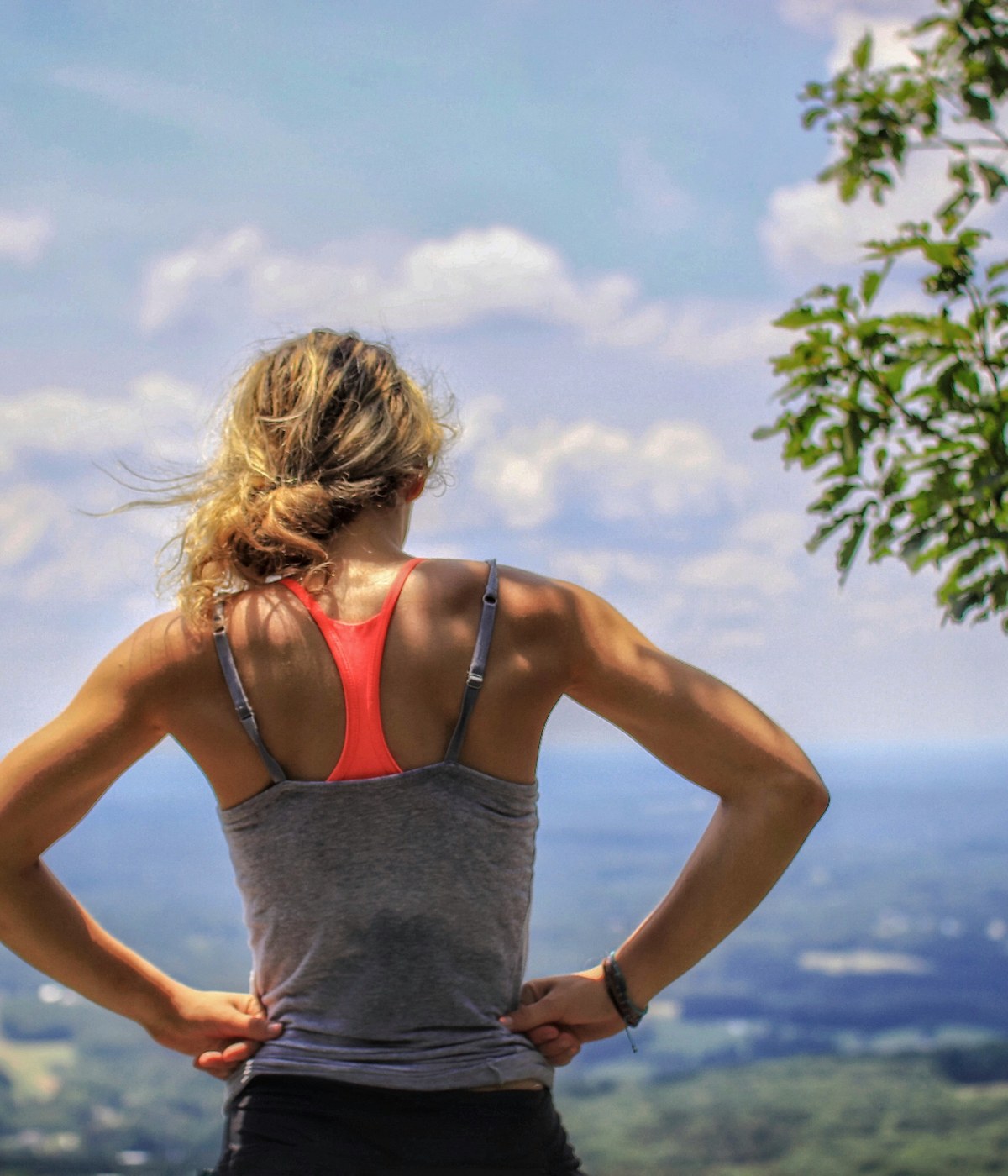 A woman hiker overlooking a mountain valley